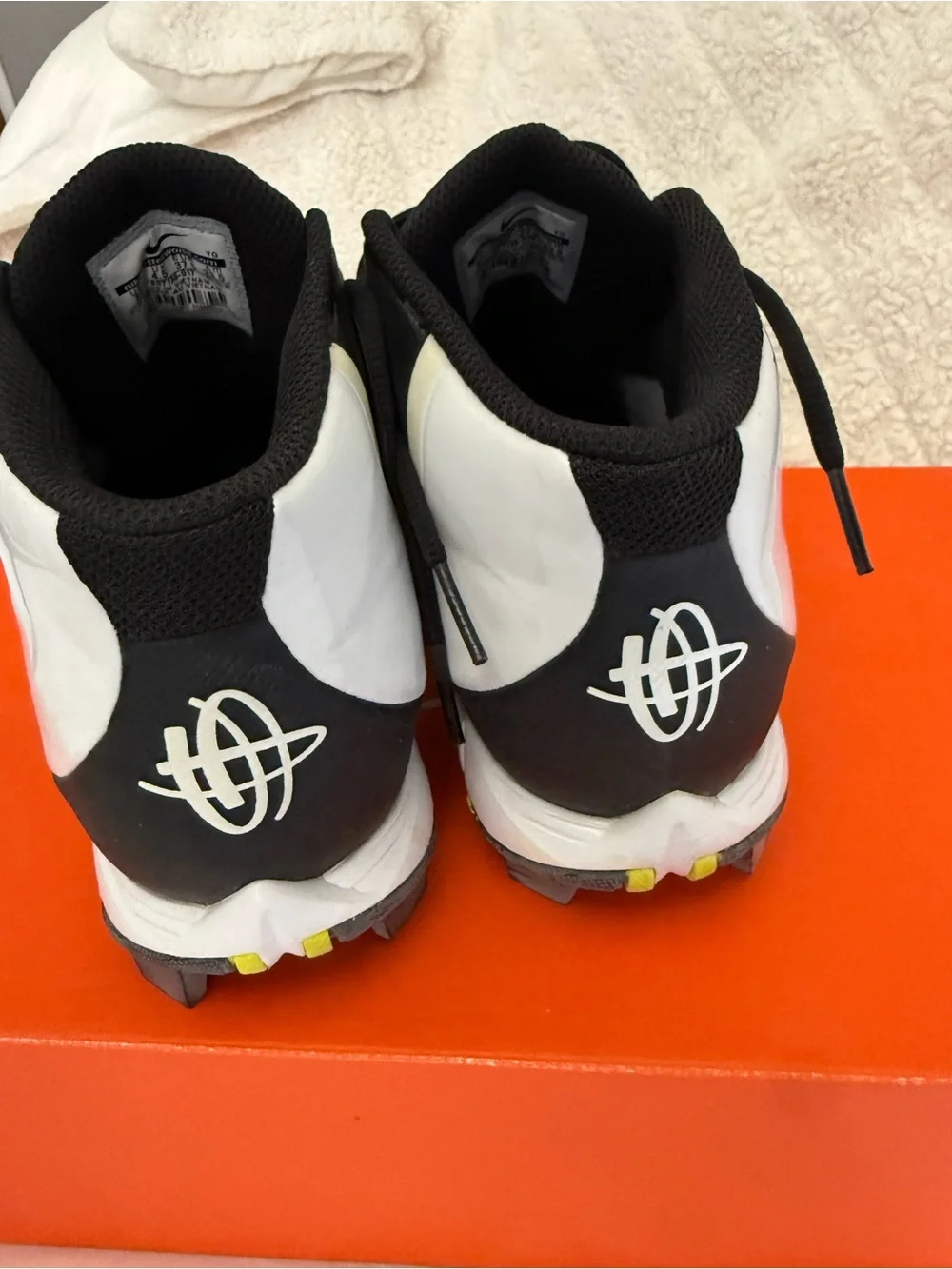 Nike youth Black and White High-Top baseball cleats Sneakers